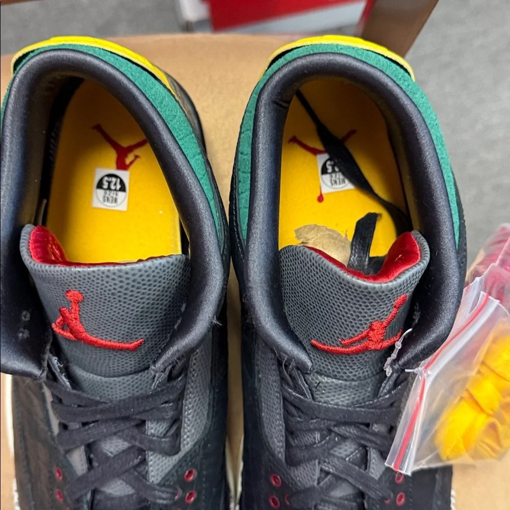 Jordan Low-Top Sneakers in Black with Red, Yellow, and Green Accents